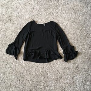 Frilly black dress shirt.